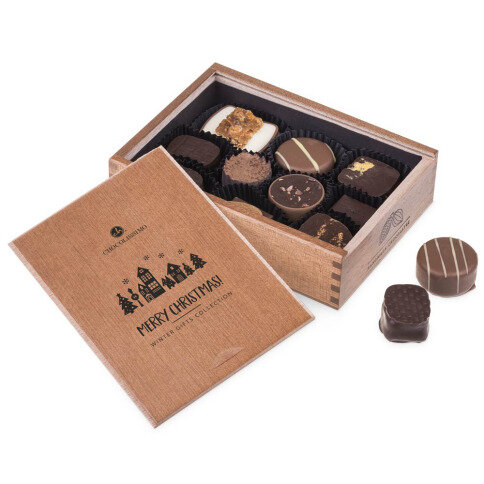 wooden chocolate box with pralines, Christmas chocolate pralines