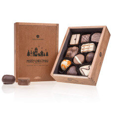 wooden chocolate box with pralines, Christmas chocolate pralines